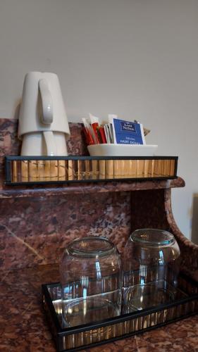 two glass jars on a tray on a counter at Repos à Ribérac B&B in Ribérac
