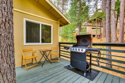 a grill on a deck next to a house at 4 Mi to Lake Arrowhead Cabin with Grill and Deck! in Twin Peaks
