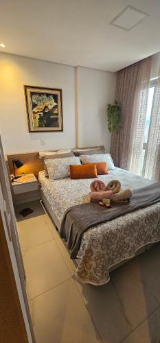 En eller flere senge i et værelse på Incrível Apartamento loft a 800 metros da Vila Germânica da Ocktoberfest