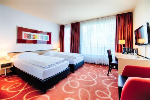 Postel nebo postele na pokoji v ubytování Welcome Kongress Hotel Bamberg