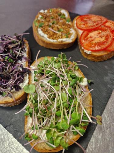 a group of three pizzas with different toppings on them at Sport relax hotel Na kopečku in Křinec