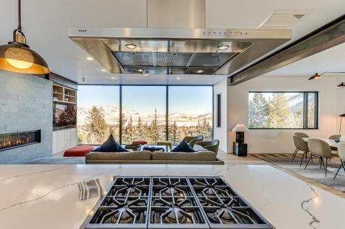 a living room with a couch and a fireplace at 1 Mi to Downtown Jackson Modern Retreat with Views in Jackson