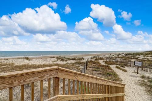 a wooden boardwalk leading to a beach with the ocean at 2034 Beachwood in Fernandina Beach