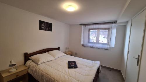 a bedroom with a bed with a tray on it at Appartement entièrement rénové proche de Paris in Créteil