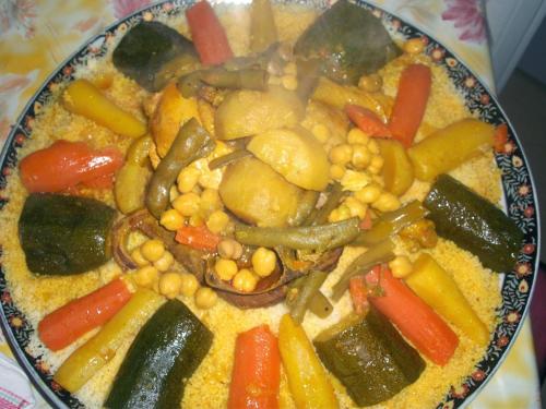 a plate of food with vegetables on a table at Hotel Espace Tifawine in Tafraoute