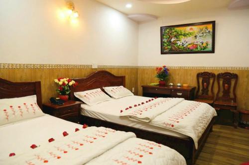 Ένα ή περισσότερα κρεβάτια σε δωμάτιο στο SaoMai Hotel - Khách Sạn SaoMai