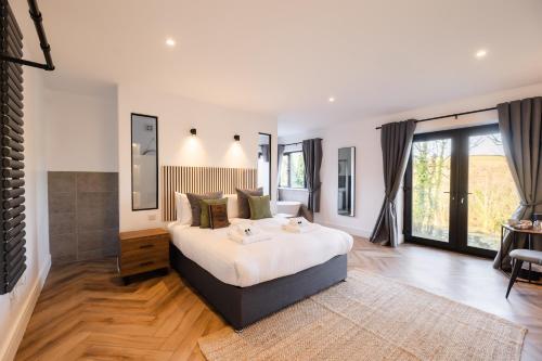 a bedroom with a large bed in a room at The Old House 1147 in Bridgend