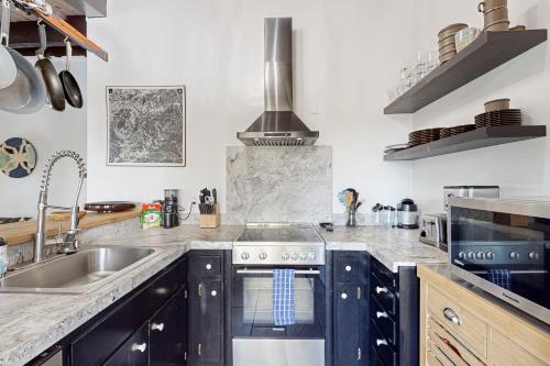a kitchen with a sink and a stove at Scott Peak Lodges Condo in Alpine Meadows