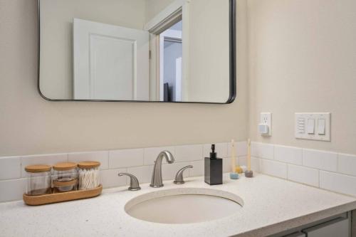 a bathroom with a sink and a mirror at Bridge City Casita in Milwaukie
