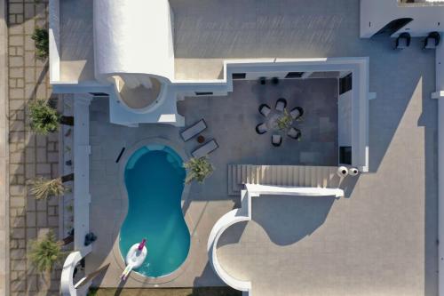 an overhead view of a swimming pool with a fountain at Rawstone Luxury Villas Jaipur in Jaipur