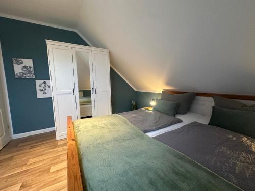 Cama o camas de una habitación en Auszeit Norddeich I 5 Minuten zu Fuß zum Meer