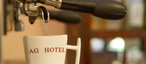 a coffee cup with the words ac hotel on it at AG Hotel Gondar in Gonder
