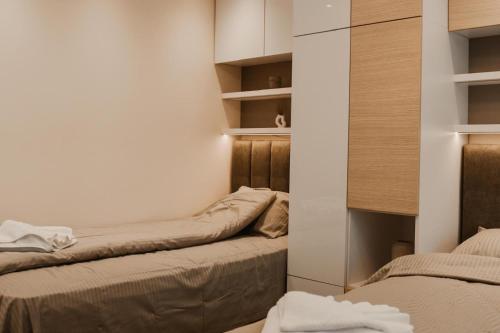 Katil atau katil-katil dalam bilik di Apartmani "AS"