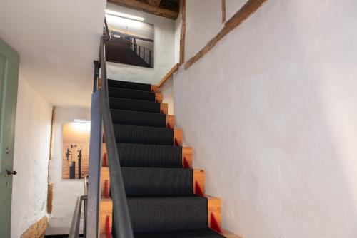 a staircase leading up to the second floor of a house at Haus im Zitronengässele in Lindau