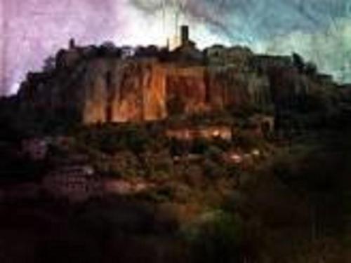 a painting of a castle on top of a mountain at Hotel Valentino Centro Storico in Orvieto