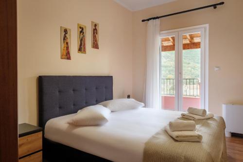 Ένα ή περισσότερα κρεβάτια σε δωμάτιο στο Sofia's House