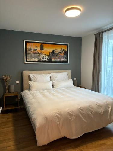 Ένα ή περισσότερα κρεβάτια σε δωμάτιο στο Rooftop Apartment,Business trip,Fast Internet