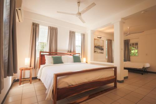 a bedroom with a large bed in a room at Alma Vida Hotel in Manuel Antonio