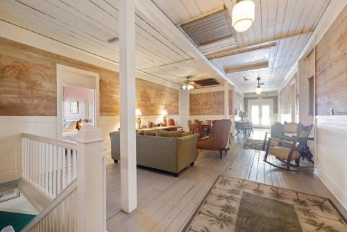 a living room with a couch and a table at Historic Island Hotel Room 23 in Cedar Key
