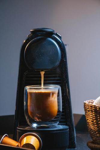 a coffee maker is making a cup of coffee at Main By Babel in Mendoza