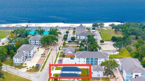 an aerial view of a town with houses and the ocean at Walk to the beach, comes with two bikes, fully fenced in back yard! in Biloxi