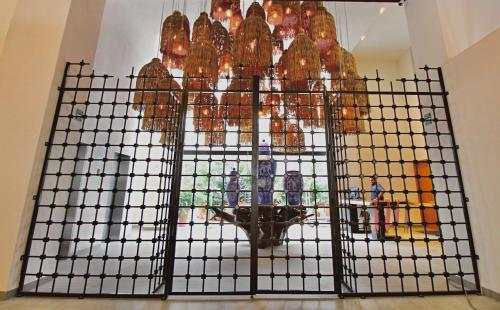 a cage full of birds sitting on top of a building at LIFE Bucerias Zona Dorada Tranquil Beach Loft in Bucerías
