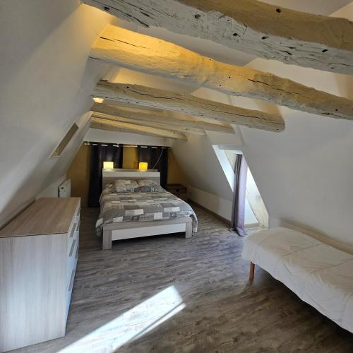 Postel nebo postele na pokoji v ubytování Gîte Les Combes Montignac Lascaux