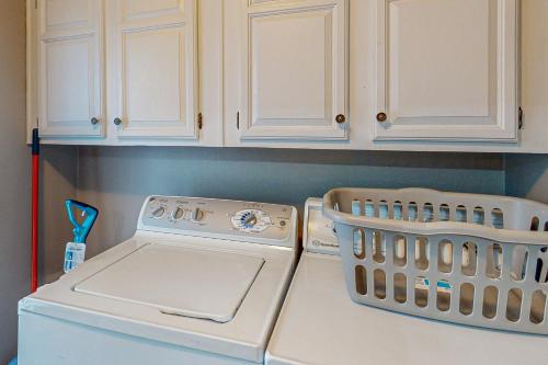 a kitchen counter with a stove and a dishwasher at The Loblolly in Bella Vista