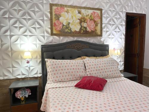 Una cama o camas en una habitación de Pousada Cascata dos Amores