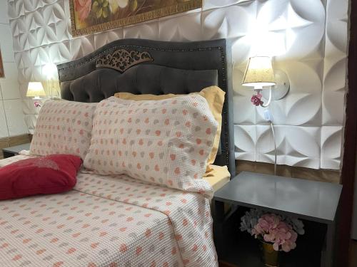 Una cama o camas en una habitación de Pousada Cascata dos Amores