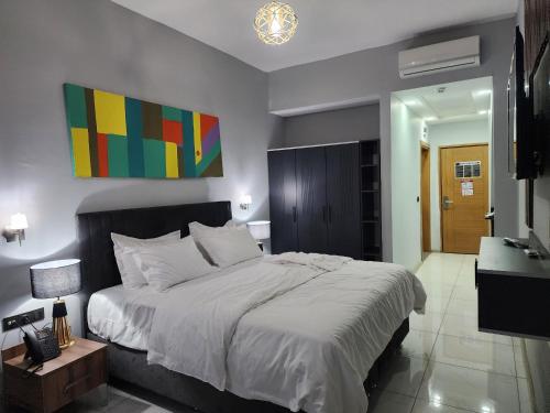 Ein Bett oder Betten in einem Zimmer der Unterkunft Albatros Premium Hôtel