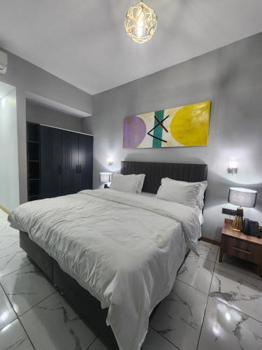 Ein Bett oder Betten in einem Zimmer der Unterkunft Albatros Premium Hôtel