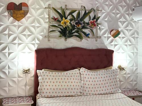 Una cama o camas en una habitación de Pousada Cascata dos Amores