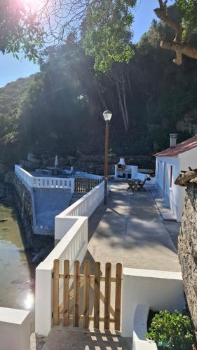 a stairway with a fence next to a building at Casa do Rio in Odeceixe