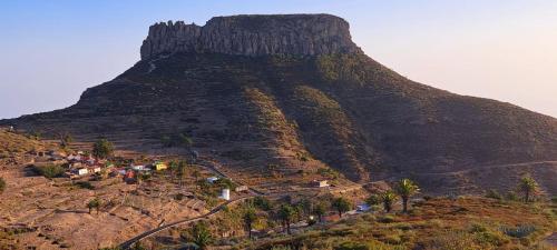 a mountain with a village on the side of it at Casa Pavón de La Fortaleza Chipude in El Cercado