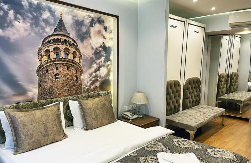 a bedroom with a bed with a picture of a tower at Elite Marmara Bosphorus & Suites in Istanbul
