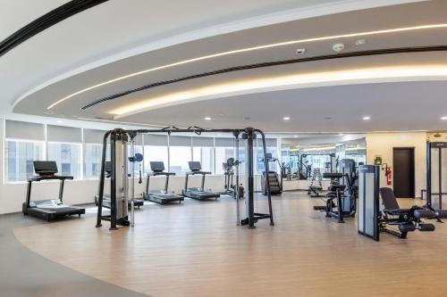 a gym with treadmills and cardio equipment in a building at Le Royal Meridien Abu Dhabi in Abu Dhabi
