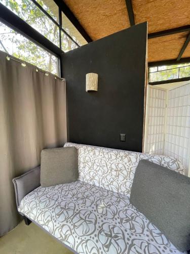 Postel nebo postele na pokoji v ubytování Centro Sati Bungalow