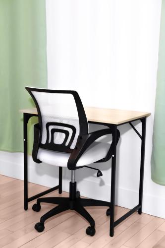 a black and white chair sitting at a desk at Relaxx - 3Brighton Beach - Green3057 in Brooklyn