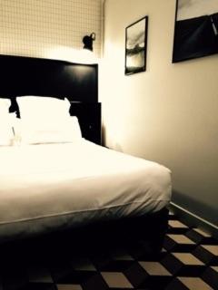 Ένα ή περισσότερα κρεβάτια σε δωμάτιο στο Urban Style Hotel des Carmes