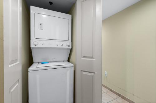 a washer and dryer in a room with a door at Seaside Resort in Myrtle Beach