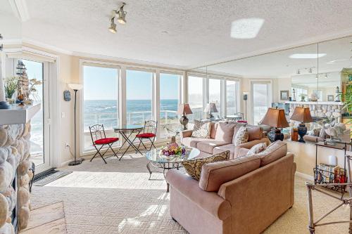 a living room with a couch and a table at Ocean Star in Depoe Bay