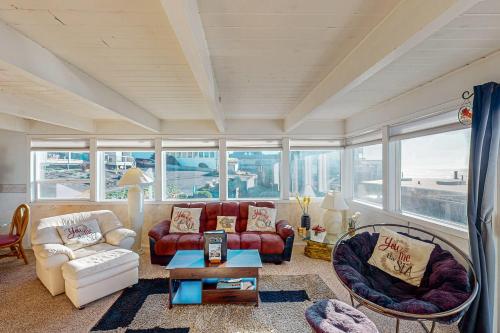 a living room with a couch and a table at Sebastian's Crib Condo in Lincoln City
