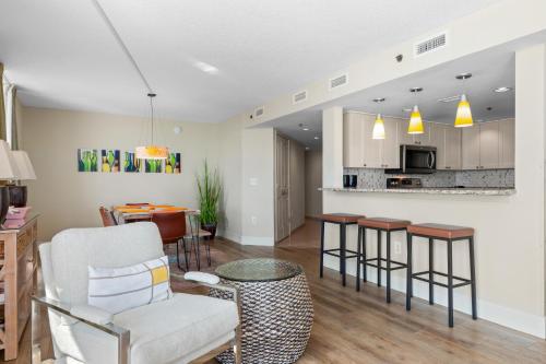 a living room with a kitchen and a dining room at Seaside Resort in Myrtle Beach