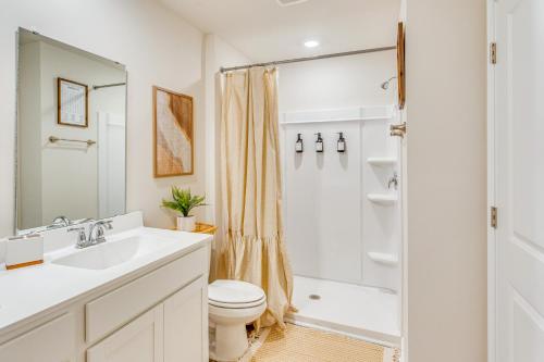 a bathroom with a sink and a toilet and a shower at Near Golf Courses Cozy Home in Ocean Isle Beach! in Ocean Isle Beach