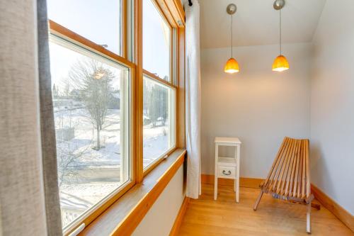 a room with a large window and a chair at Family-Friendly Retreat in Barre 2 Spacious Decks in Barre