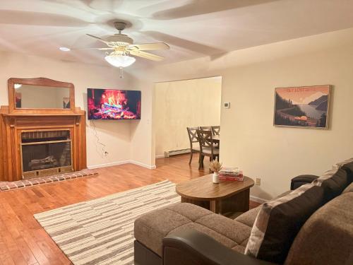 a living room with a couch and a fireplace at Cozy & Private Retreat Near Atlantic City! in Galloway