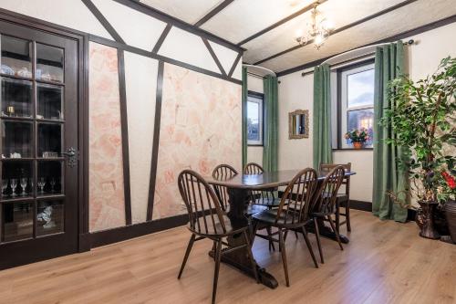 a dining room with a table and chairs at Criss Cross Cottage in Inverness