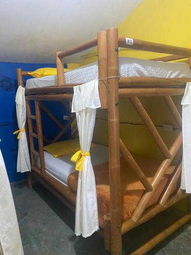 two bunk beds in a room with towels at Home Beach Kristalu in Cartagena de Indias