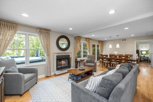 a living room with a couch and a fireplace at Blue Beech Cottage in Union Pier